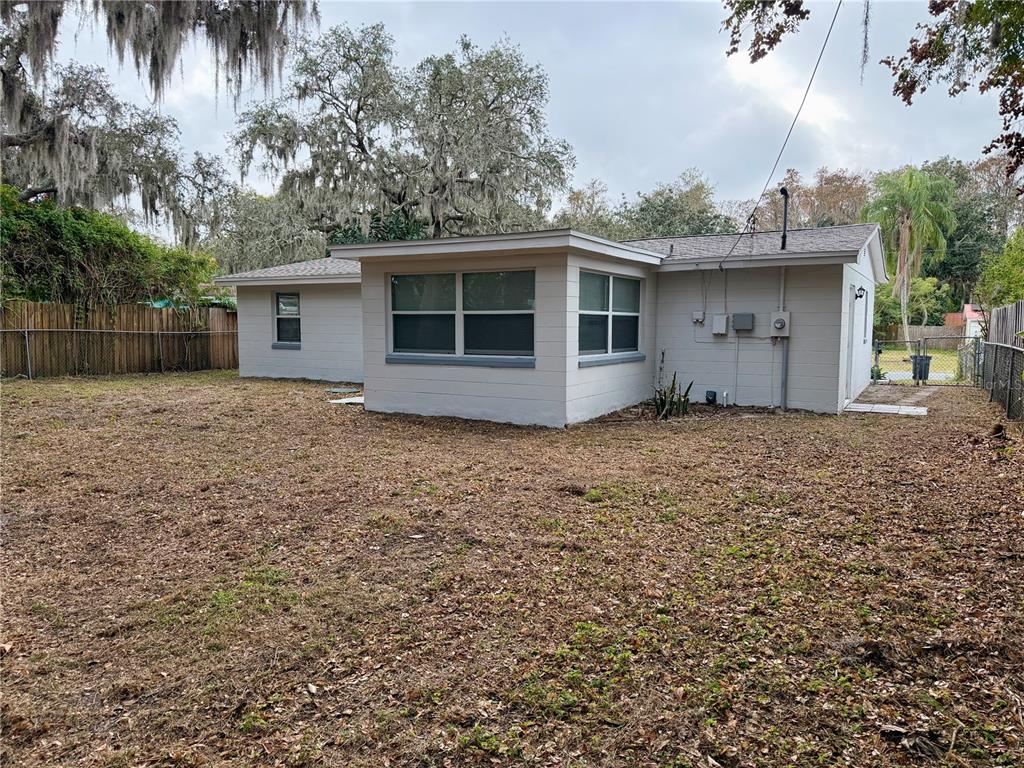 7441 Banner Street New Port Richey, FL 34653 - Photo 5 of 20 front view of a house with a yard