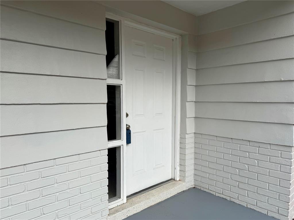 7441 Banner Street New Port Richey, FL 34653 - Photo 7 of 20 a view of front door