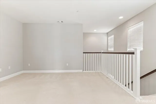 a white bath tub sitting next to a white sink and a shower