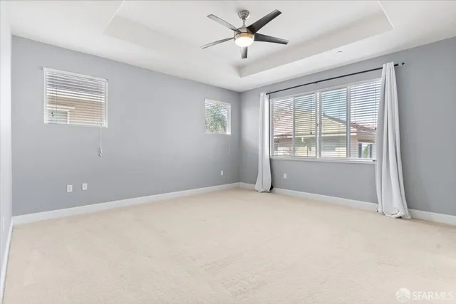 a white bath tub sitting next to a window