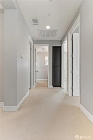 a white bath tub sitting in a bathroom next to a window