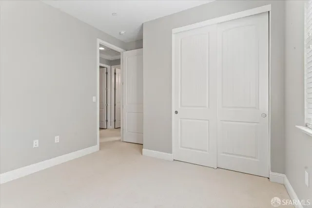 an aerial view of residential houses with city view