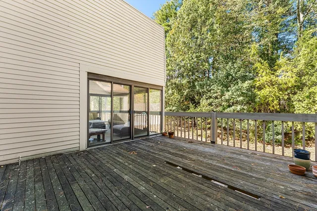a view of balcony with wooden floor
