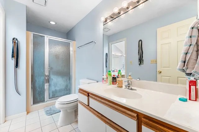 a spacious bathroom with a bathtub and toilet