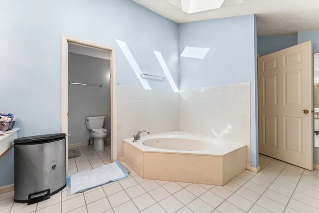 a bedroom with a workspace