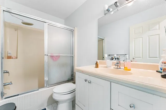 a view of an empty room with a bathroom