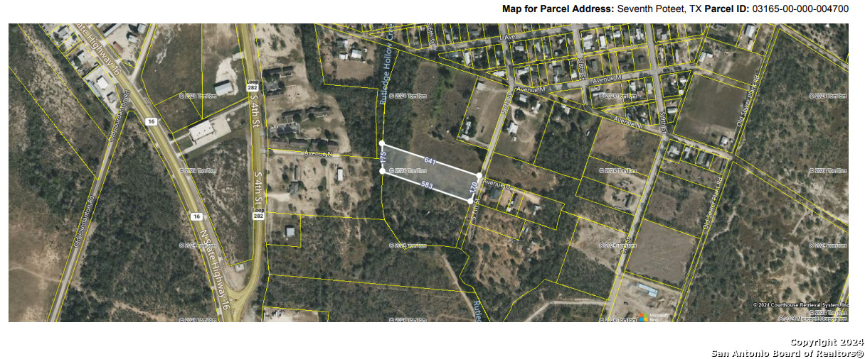 1075 7th Street Poteet, TX 78065 - Photo 4 of 8 a bathroom with a shower and a sink