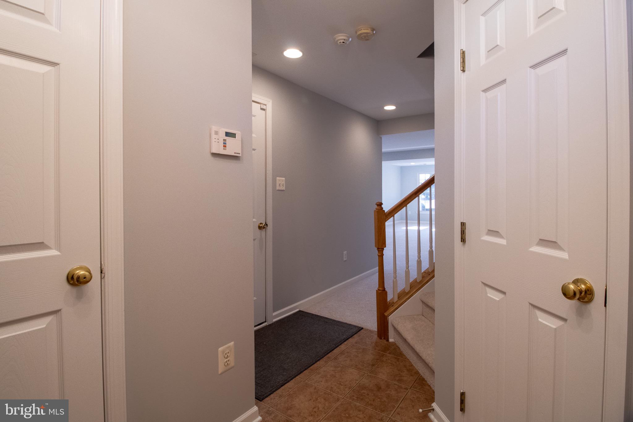 98 Lullwater Way Falling Waters, WV 25419 - Photo 4 of 43 a view of a hallway with entryway door