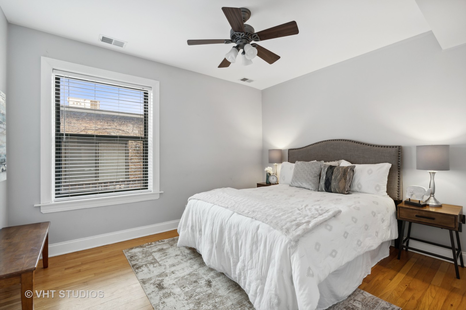 1155 West Grace Street, Unit 2N Chicago, IL 60613 - Photo 14 of 20 a bedroom with a bed and a window