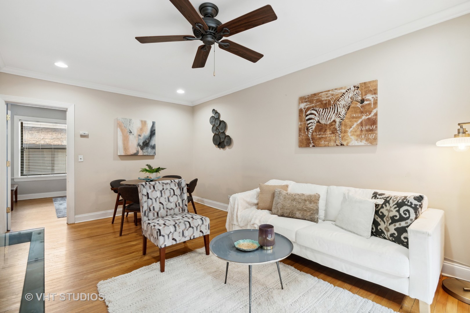 1155 West Grace Street, Unit 2N Chicago, IL 60613 - Photo 6 of 20 a living room with furniture and a wooden floor