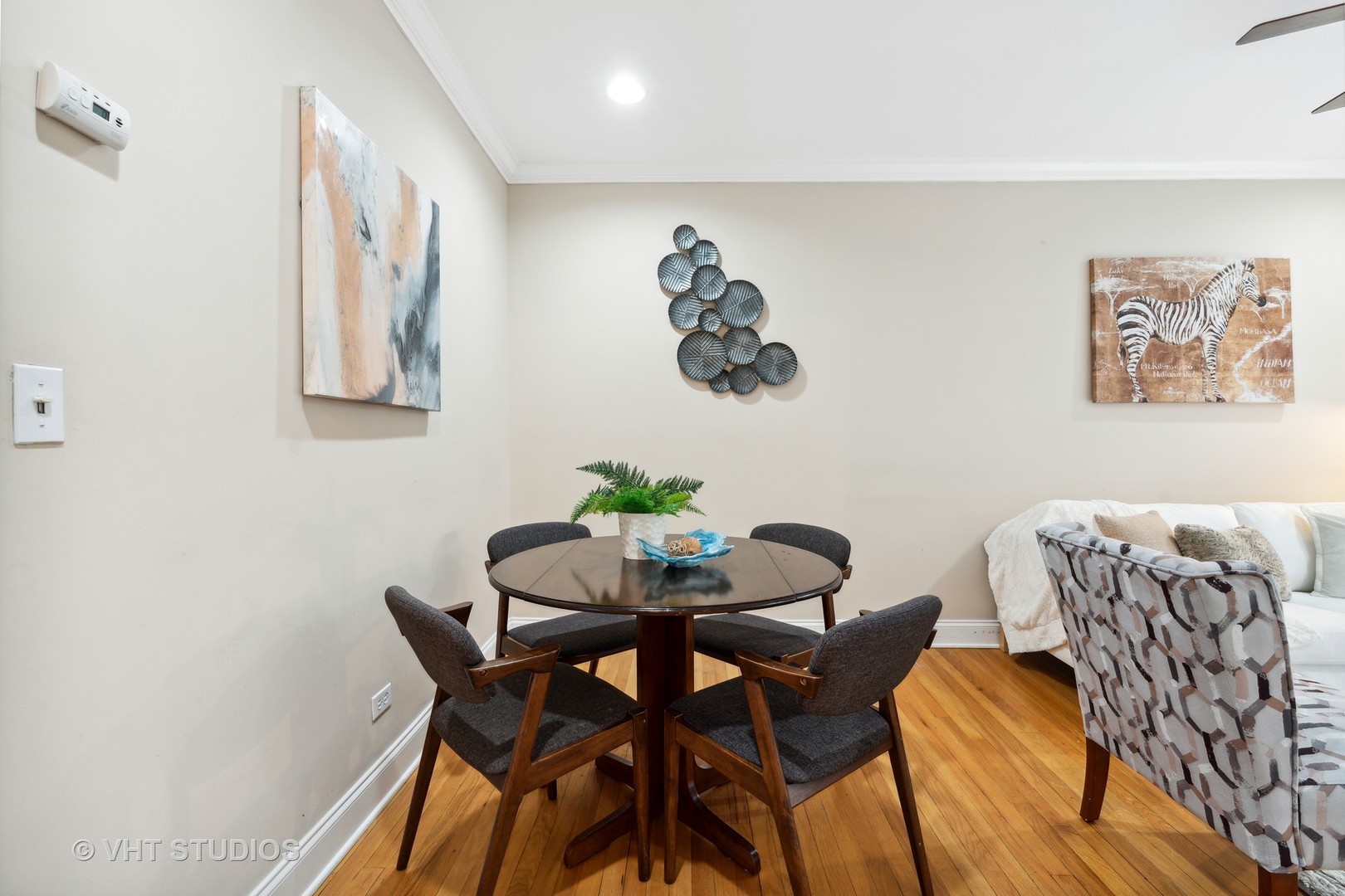 1155 West Grace Street, Unit 2N Chicago, IL 60613 - Photo 8 of 20 a dining room with furniture and wooden floor