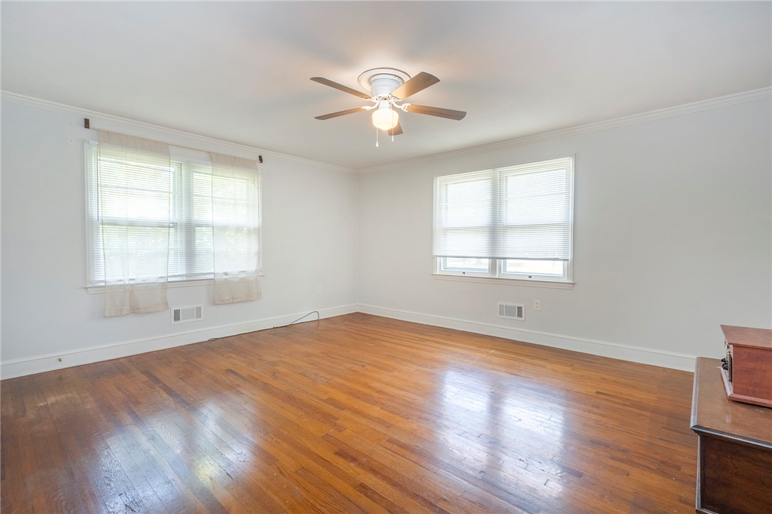 1218 Bolt Drive Anderson, SC 29621 - Photo 33 of 46 Hardwood floors and a ceiling fan create a comfortable atmosphere in this well-lit room.