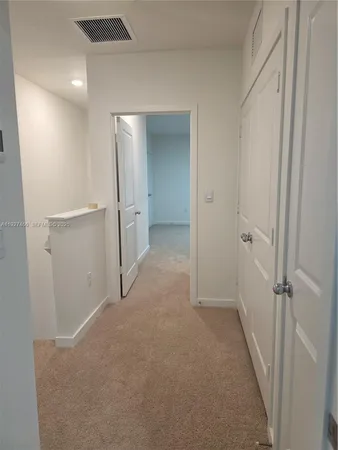 a view of a big room with closet and wooden floor