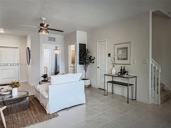 a living room with furniture and a table