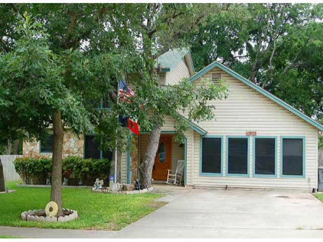 9222 Independence Loop Austin, TX 78748 - Photo 1 of 1 a front view of a house with a yard and trees