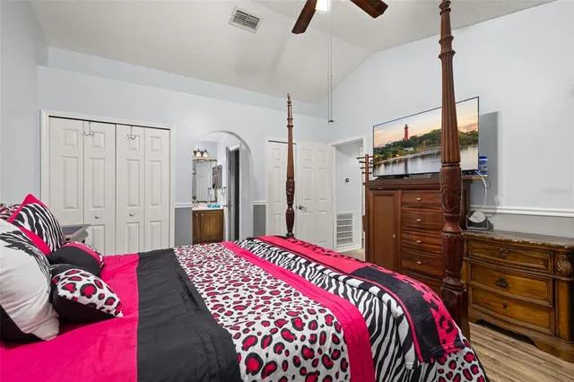 a bedroom with a bed and a dresser