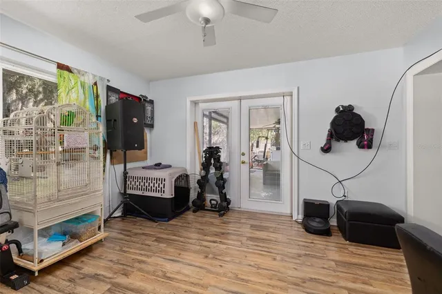 a view of a livingroom with furniture and a ceiling fan