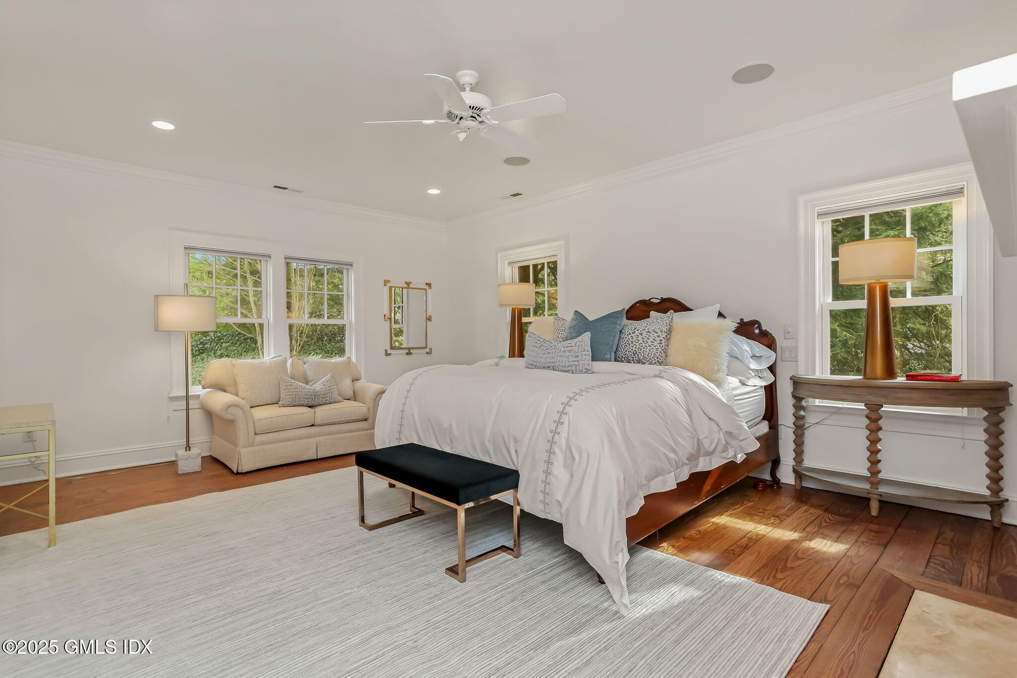 10 Francine Drive Greenwich, CT 06830 - Photo 28 of 59 a spacious bedroom with a bed a couch and large window