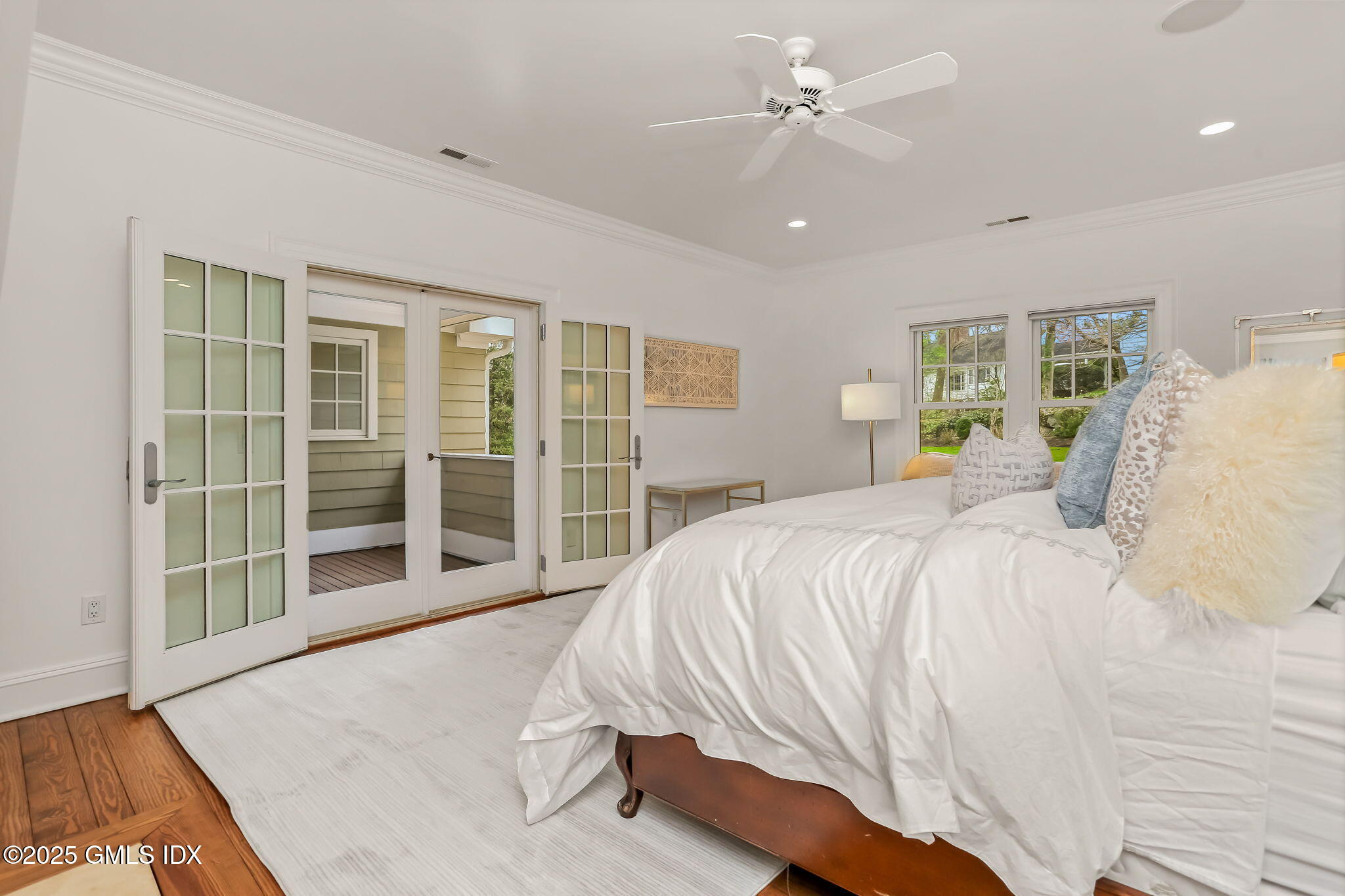 10 Francine Drive Greenwich, CT 06830 - Photo 29 of 59 a spacious bedroom with a large bed and a large window