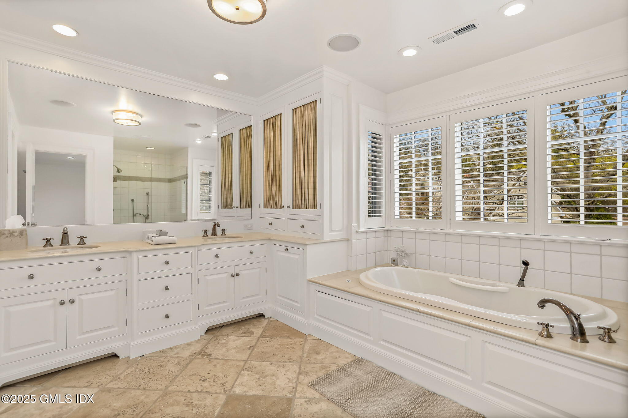 10 Francine Drive Greenwich, CT 06830 - Photo 31 of 59 a spacious bathroom with a tub sink and mirror