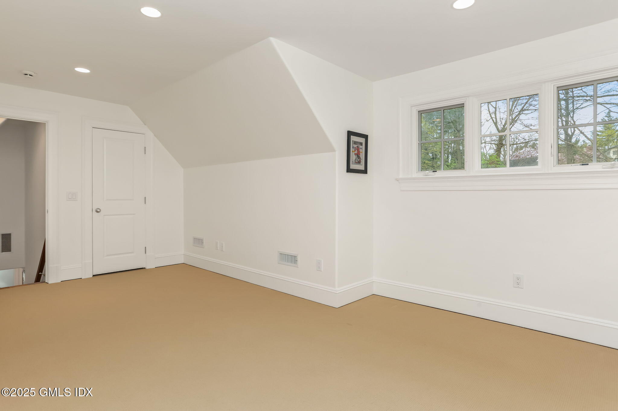 10 Francine Drive Greenwich, CT 06830 - Photo 39 of 59 wooden floor in an empty room with a window