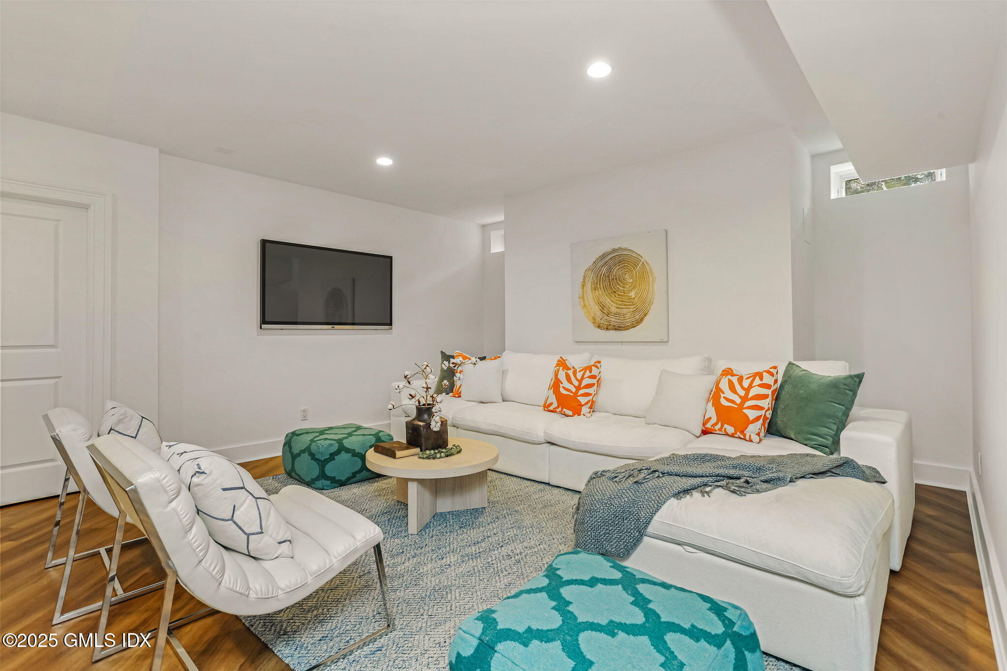 10 Francine Drive Greenwich, CT 06830 - Photo 42 of 59 a living room with furniture and a flat screen tv