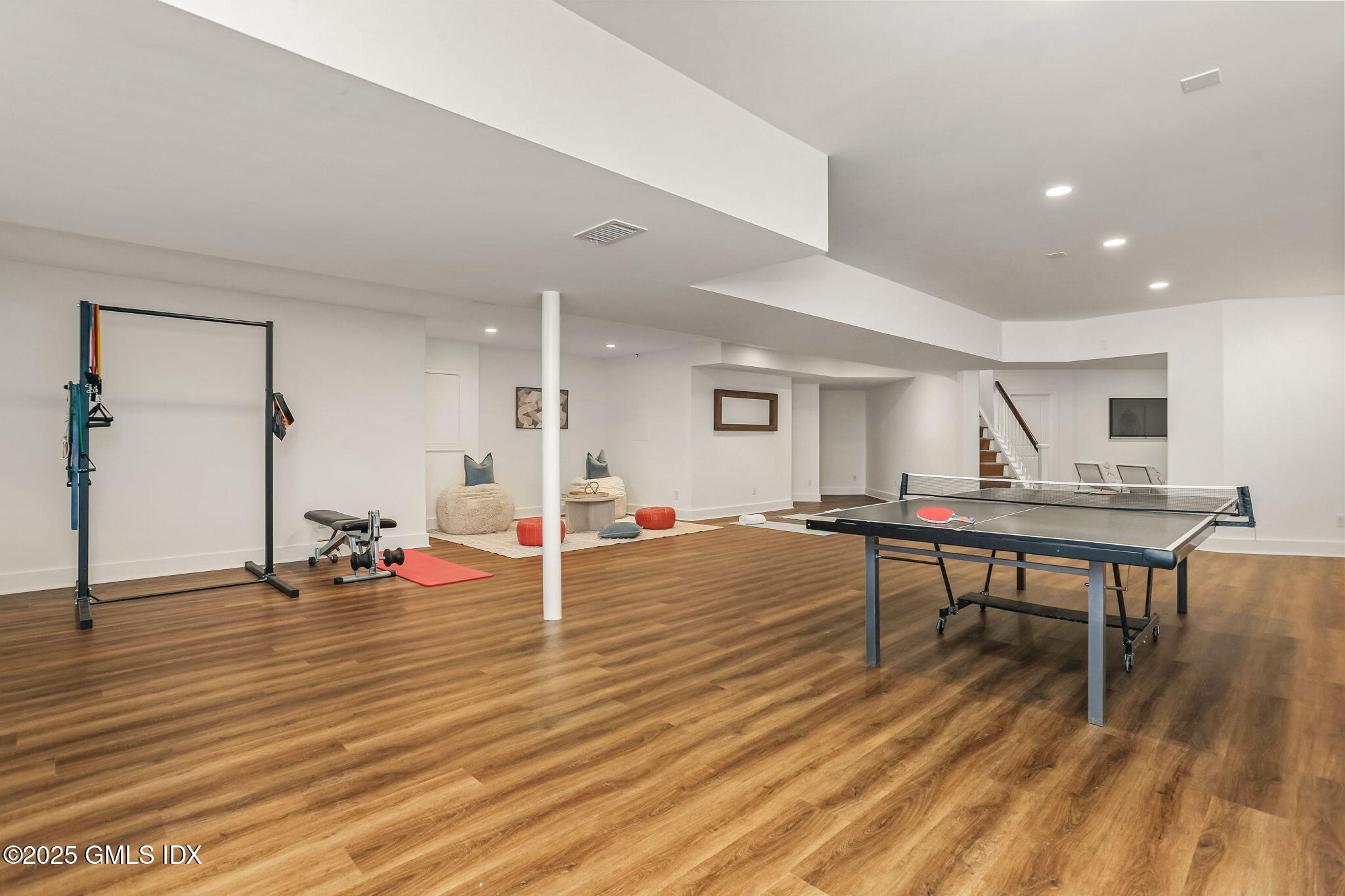 10 Francine Drive Greenwich, CT 06830 - Photo 43 of 59 a view of a room with wooden floor and furniture