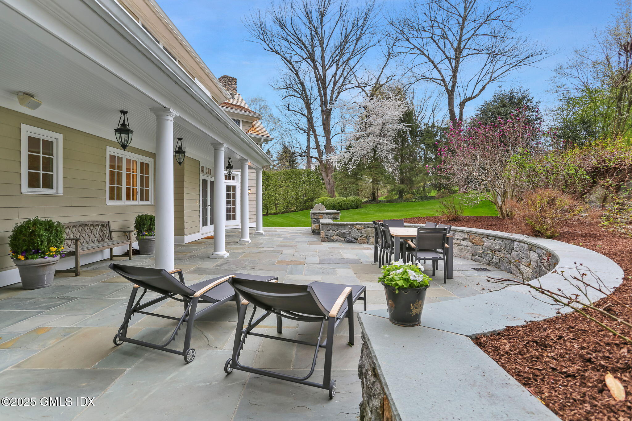 10 Francine Drive Greenwich, CT 06830 - Photo 47 of 59 a view of a backyard with sitting area and furniture