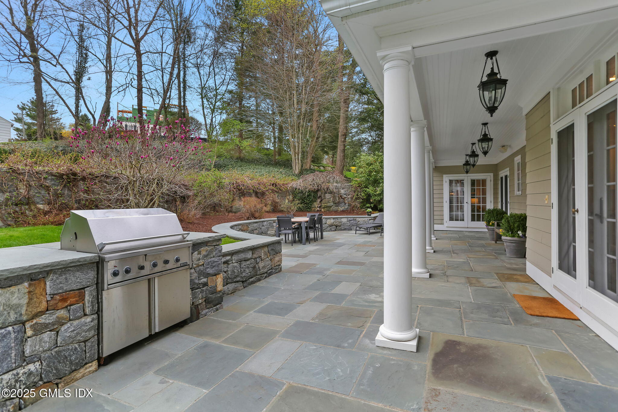 10 Francine Drive Greenwich, CT 06830 - Photo 48 of 59 a view of a patio with couches and potted plants