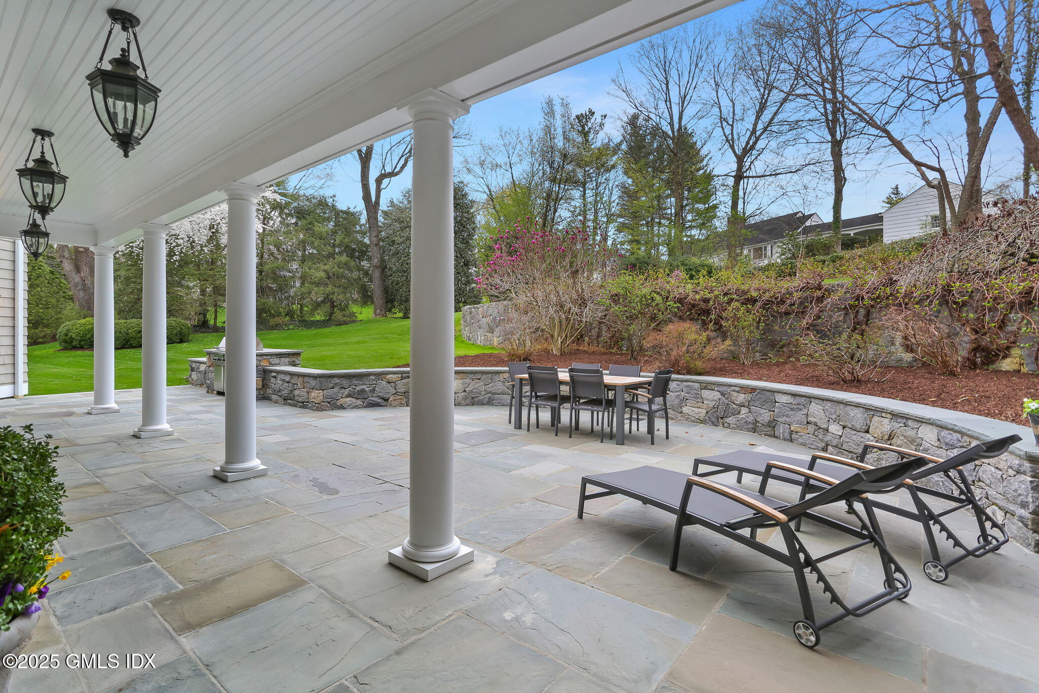 10 Francine Drive Greenwich, CT 06830 - Photo 49 of 59 a view of a patio with a table chairs and backyard