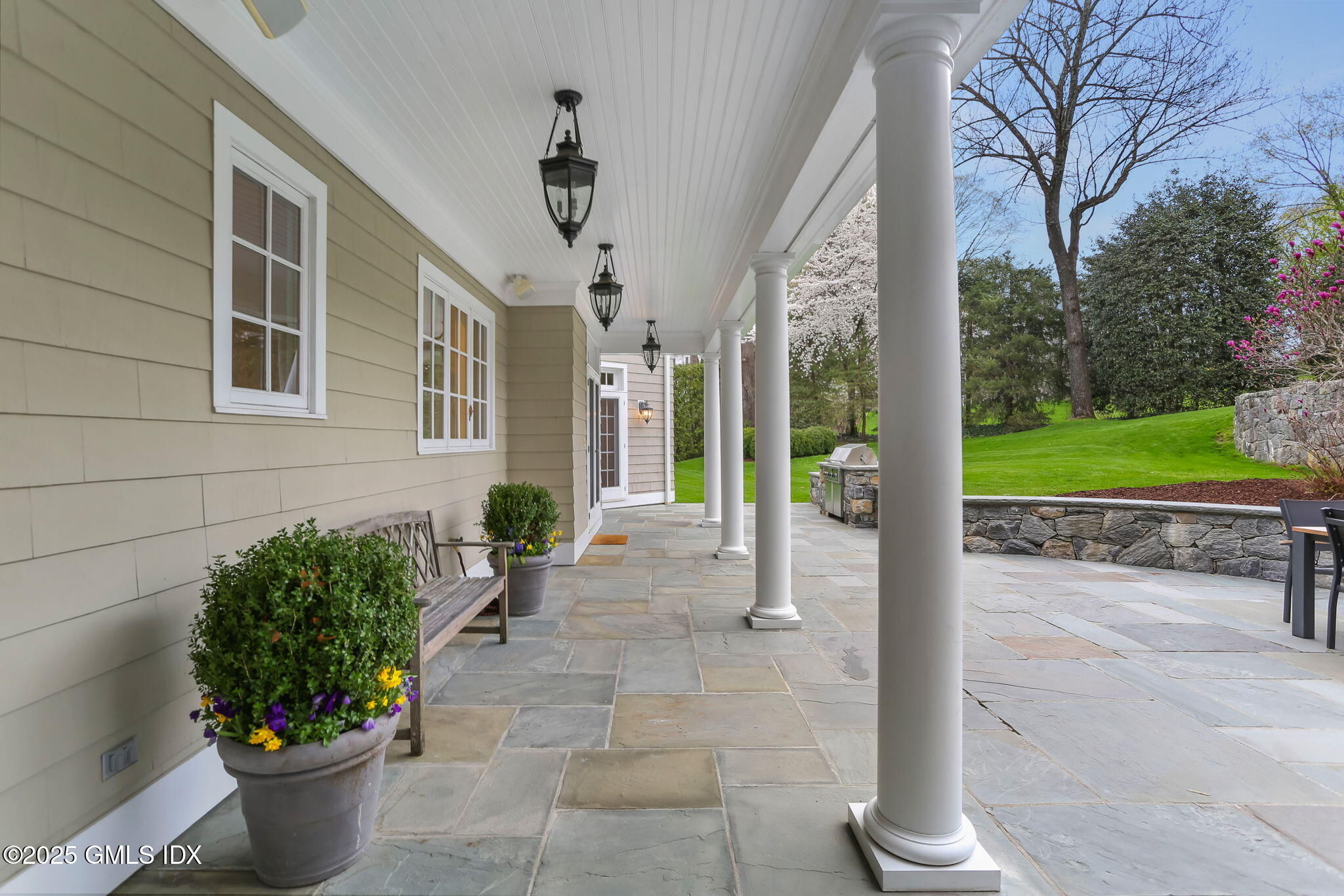 10 Francine Drive Greenwich, CT 06830 - Photo 50 of 59 a front view of a house with a garden