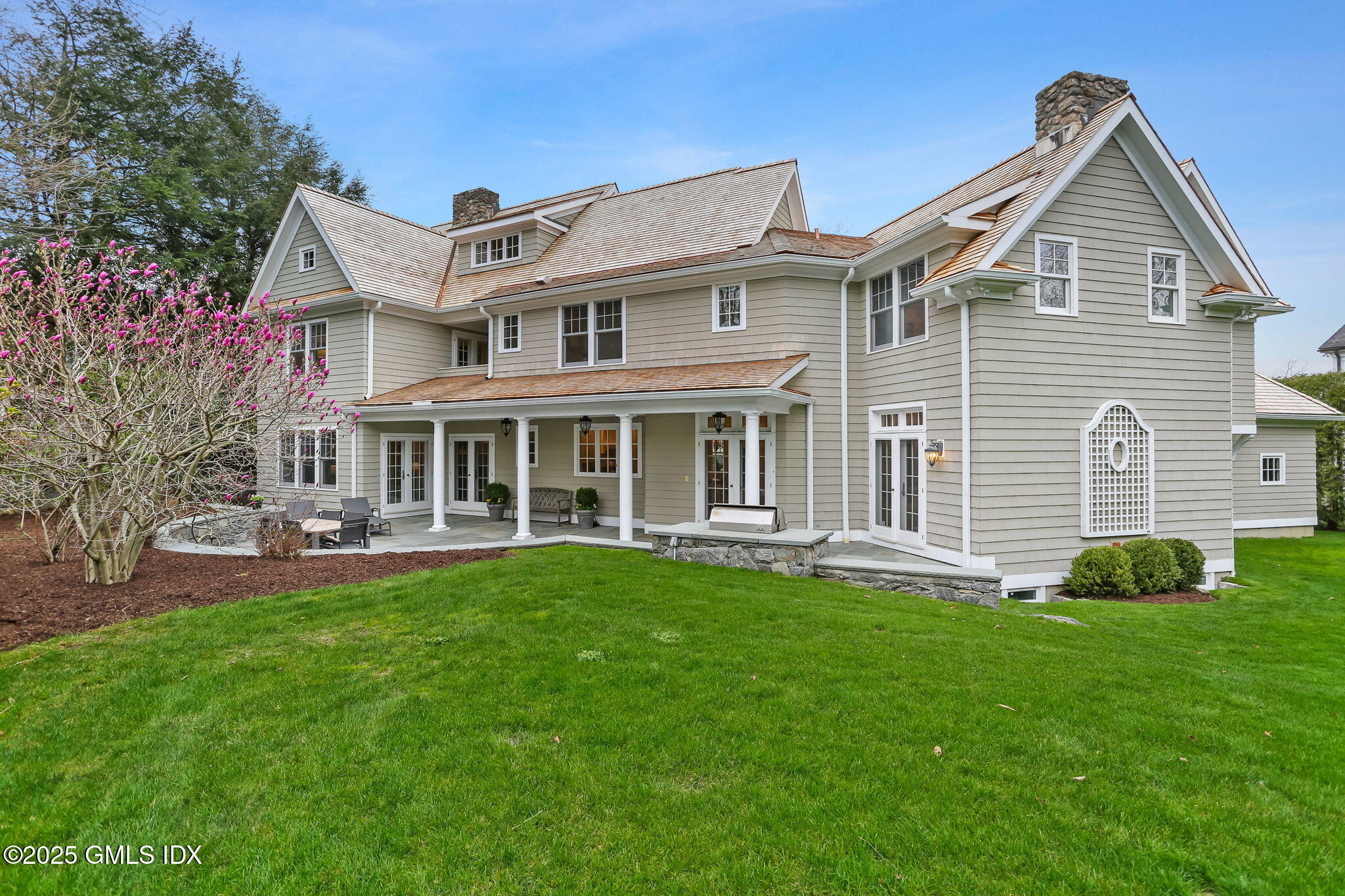 10 Francine Drive Greenwich, CT 06830 - Photo 51 of 59 a front view of a house with a yard