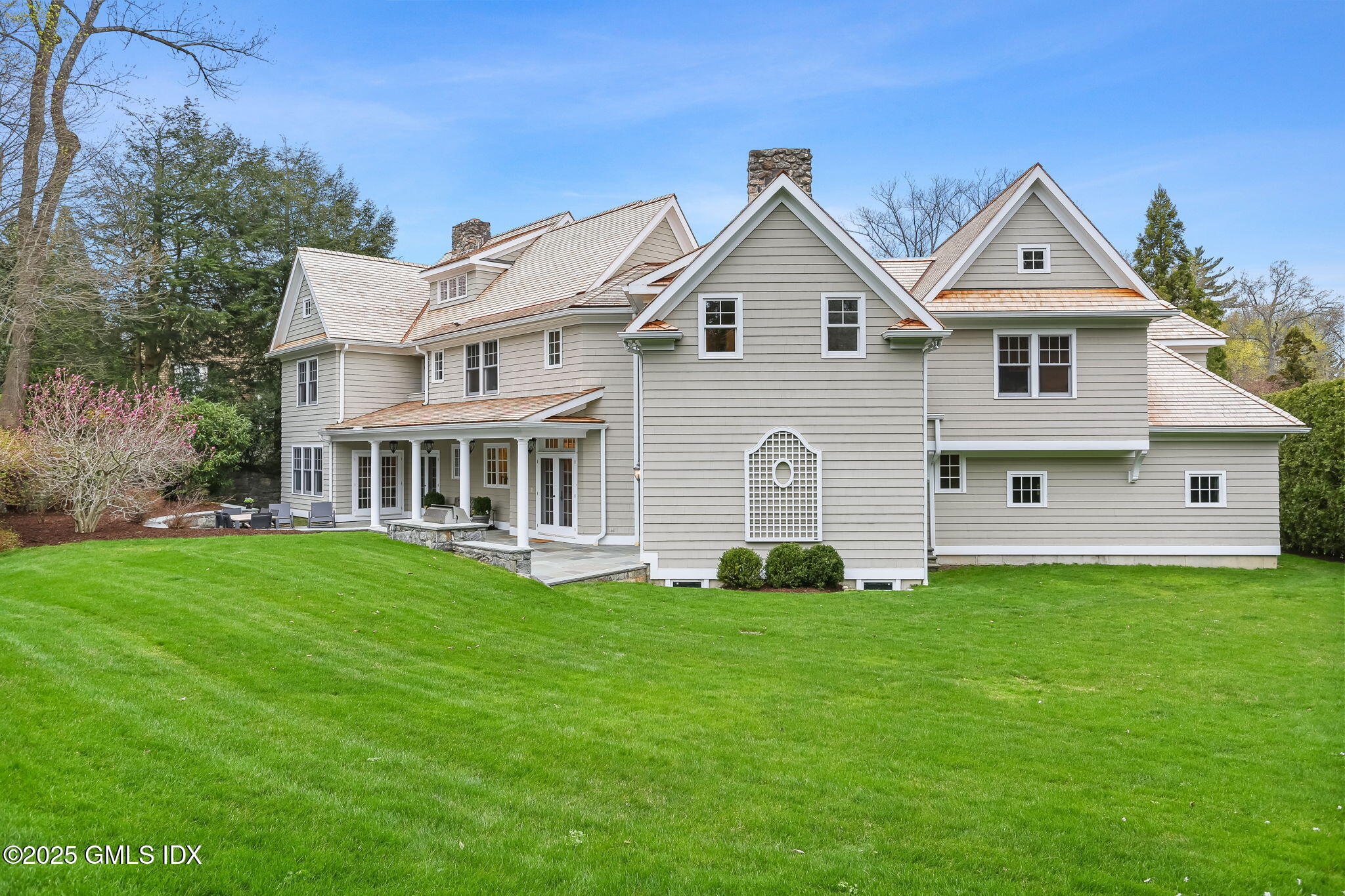 10 Francine Drive Greenwich, CT 06830 - Photo 52 of 59 a front view of a house with a yard