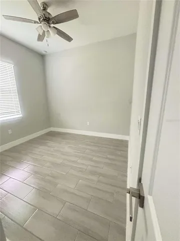 a view of an empty room with a window