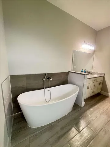 a white bath tub sitting in a bathroom