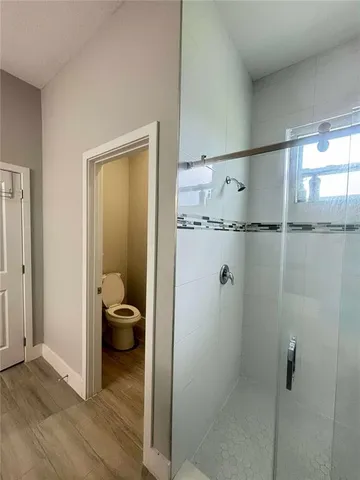 a view of a bathroom with a sink and shower