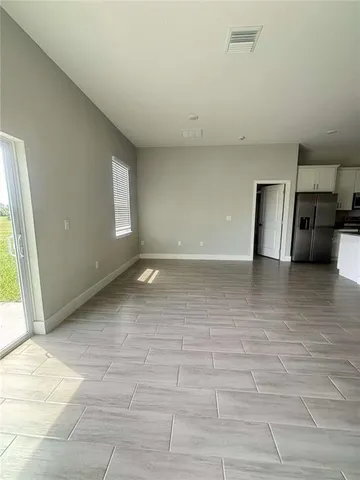 a view of empty room with a window