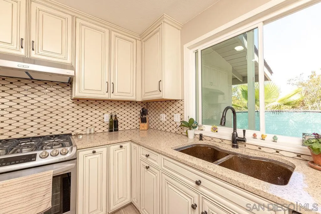 12317 Witt Road Poway, CA 92064 - Photo 16 of 43 a kitchen with a sink cabinets and window