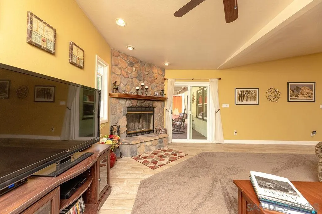 12317 Witt Road Poway, CA 92064 - Photo 23 of 43 a living room with furniture and a fireplace