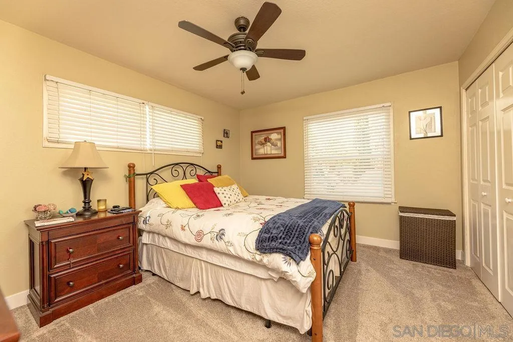 12317 Witt Road Poway, CA 92064 - Photo 28 of 43 a bedroom with a bed dresser and a window