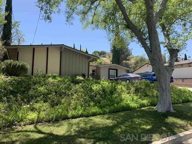 12317 Witt Road Poway, CA 92064 - Photo 9 of 43 a view of a house with a big yard plants and large trees