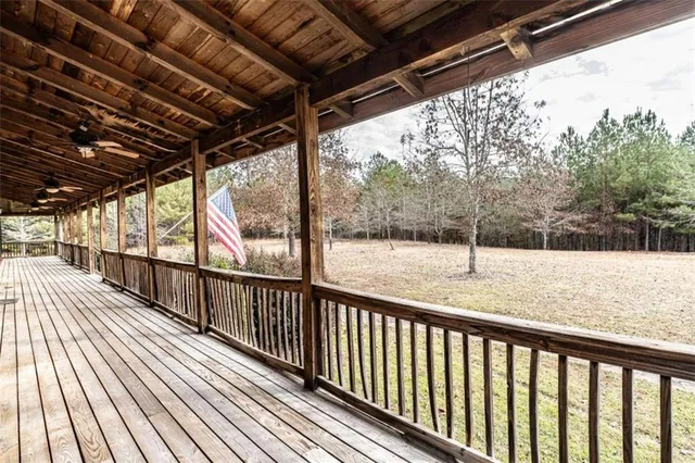 a view of balcony with wooden floor