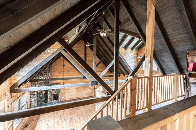 a view of an empty room with a staircase