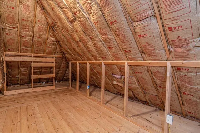 a view of a room with wooden floor