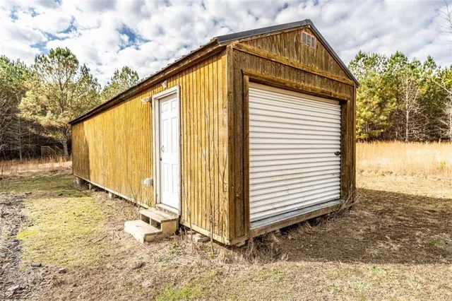 a view of empty space with large trees