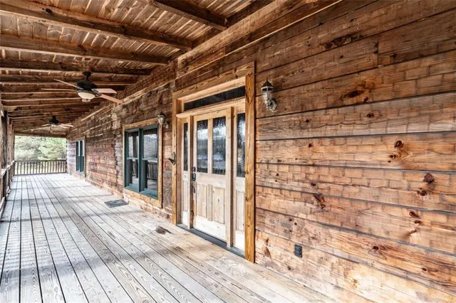 a view of a porch with wooden floor
