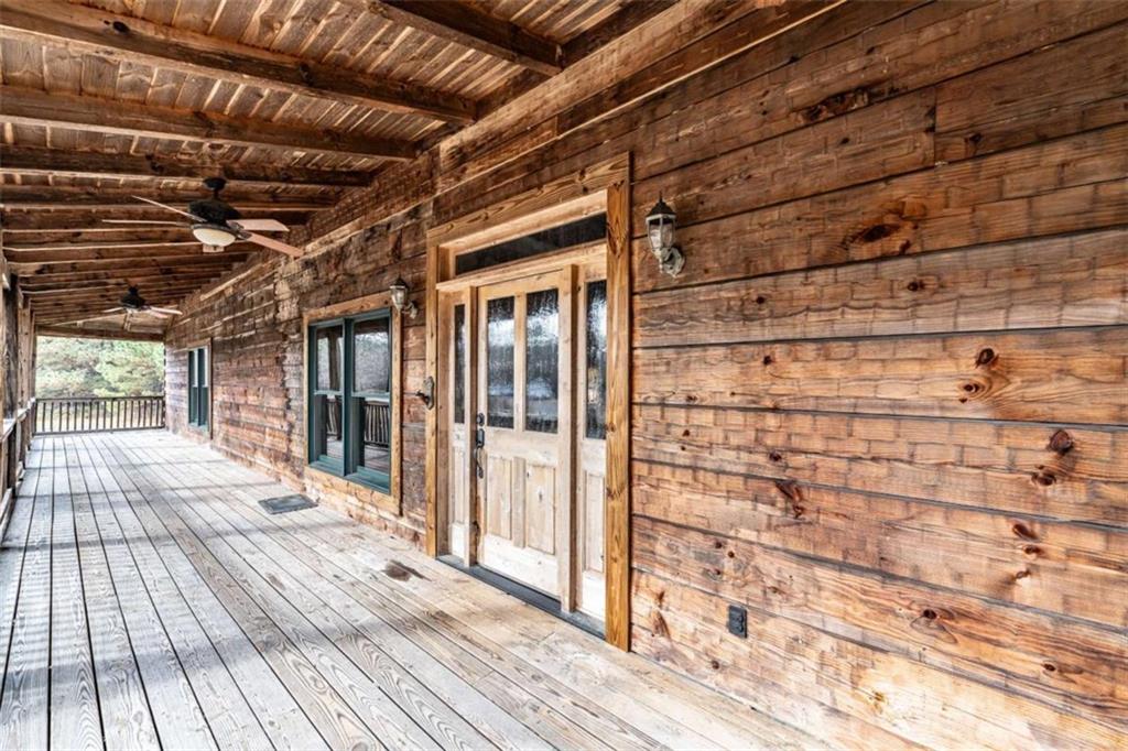 1863 New Rosedale Road Northeast Armuchee, GA 30105 - Photo 4 of 43 a view of a porch with wooden floor