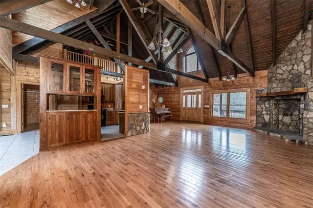 a view of a room with wooden floors and stairs