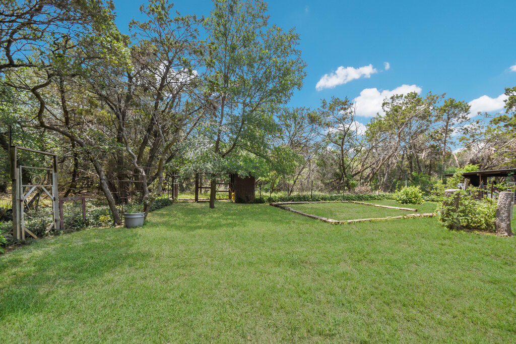301 Navajo Trail Georgetown, TX 78633 - Photo 14 of 35 a view of a field of grass and trees