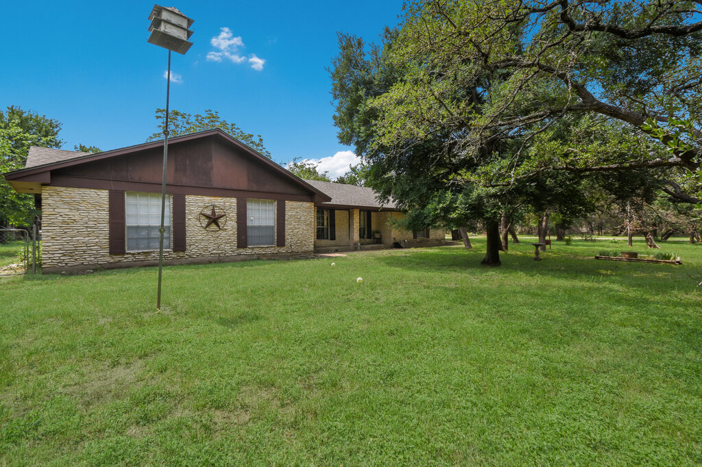 301 Navajo Trail Georgetown, TX 78633 - Photo 2 of 35 a view of an house with backyard space and garden